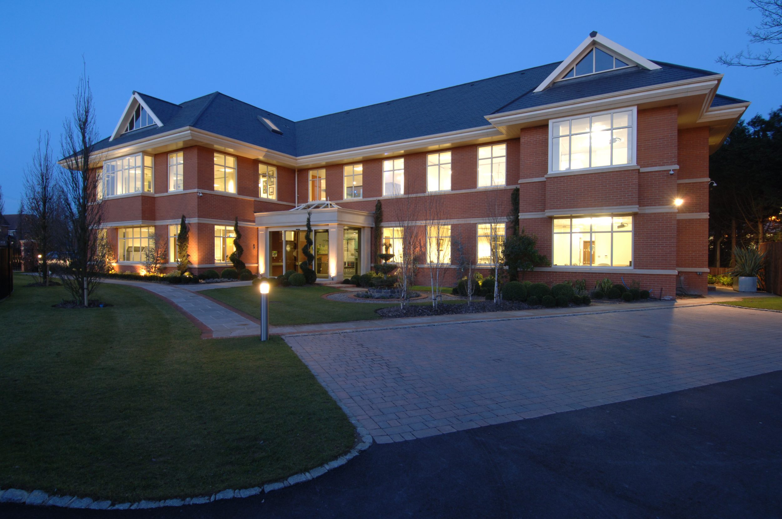 modern office block wiith aluminium casement windows after dark in berkshire