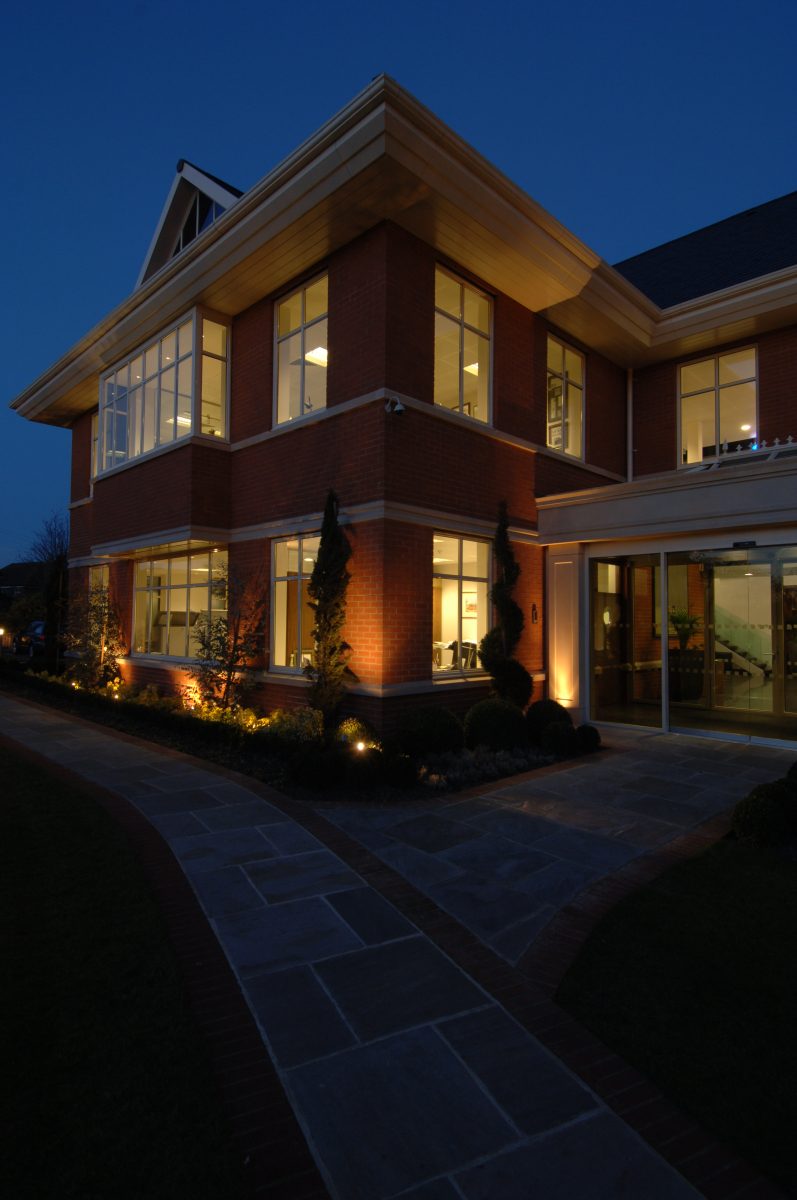 modern office block wiith aluminium casement windows after dark in berkshire