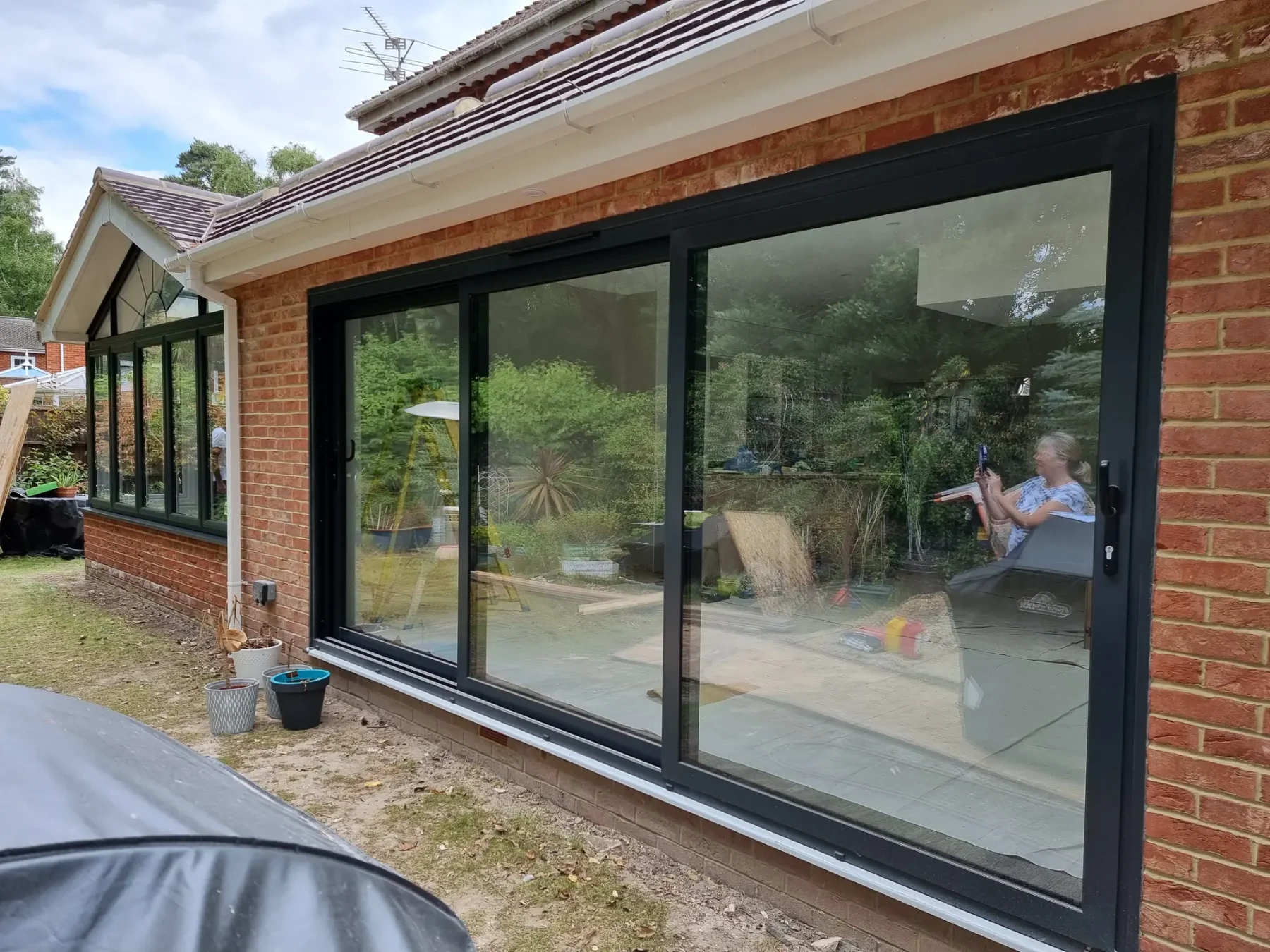 anthracite grey 3 pane patio door in brick walls in hampshire