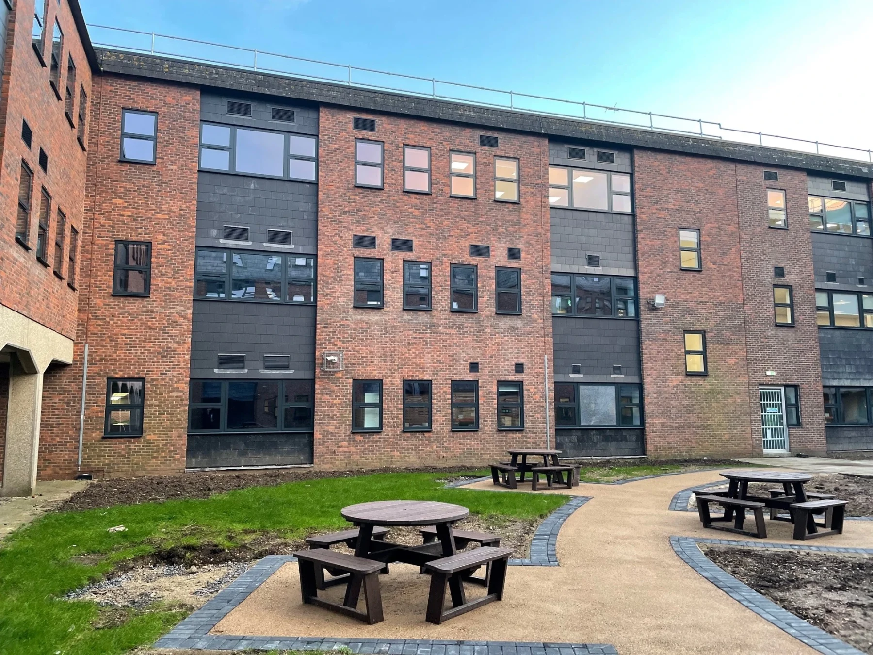 grey aluminium windows in brick office block