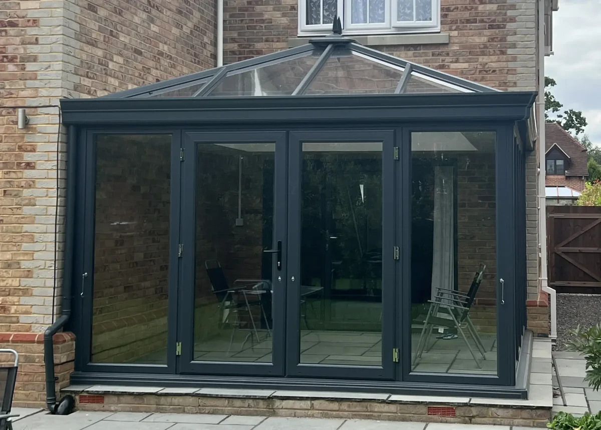 edwardian glass conservatory with anthracite grey french doors in hampshire