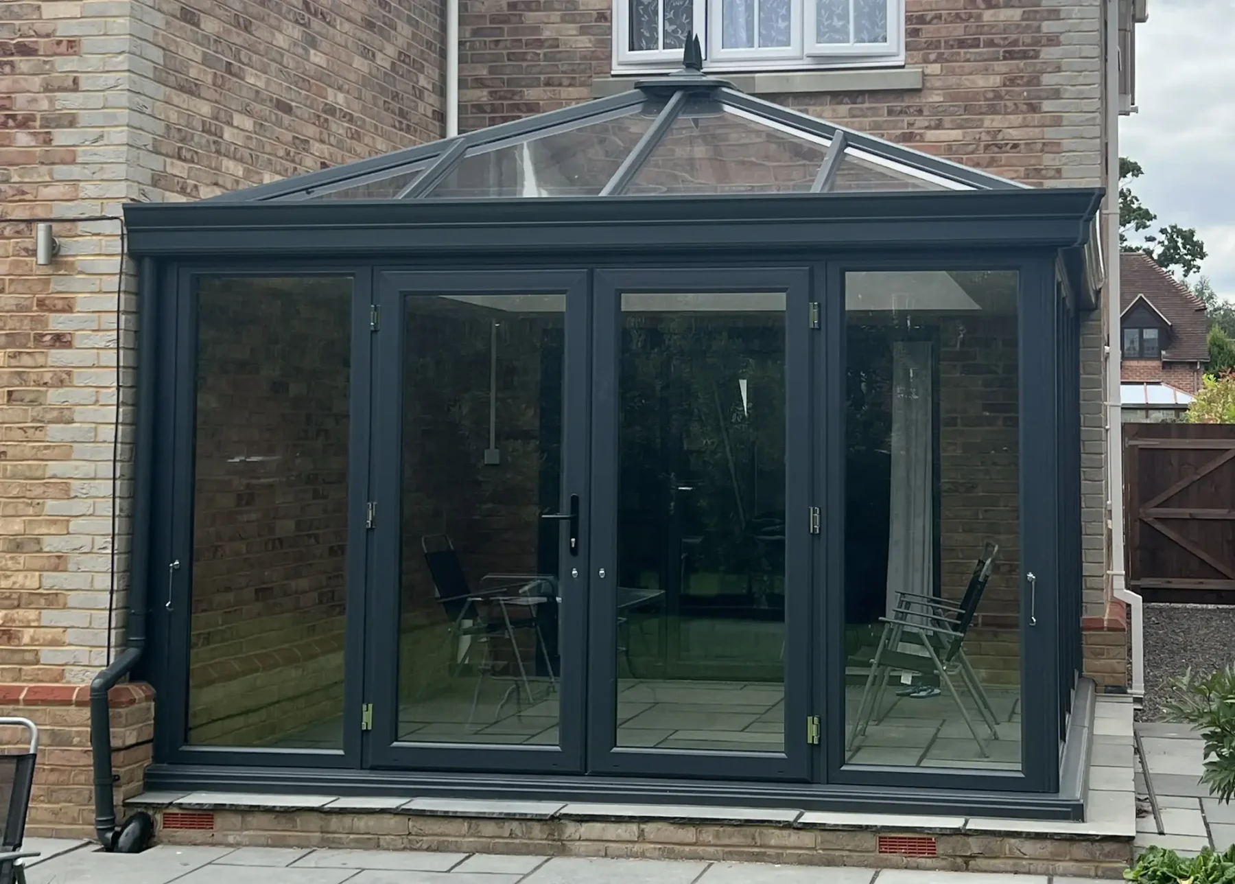 edwardian glass conservatory with anthracite grey french doors in hampshire
