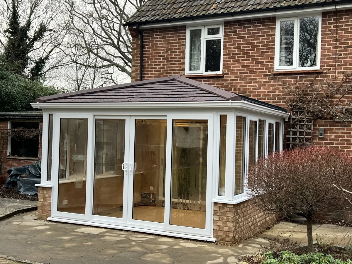 edwardian replacement conservatory roof with burnt umber metro tiles with patio doors