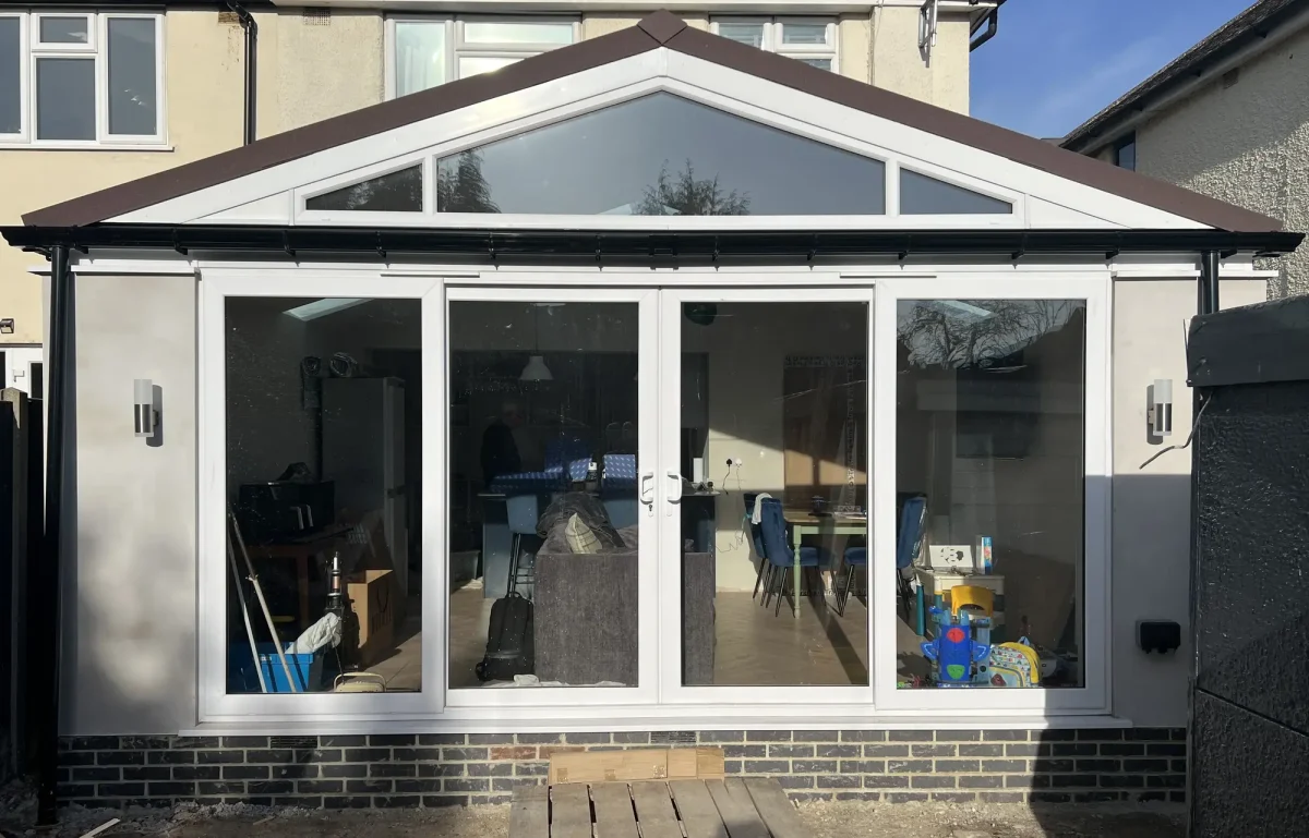 regency replacement conservatory roof with white patio doors and glass gable window
