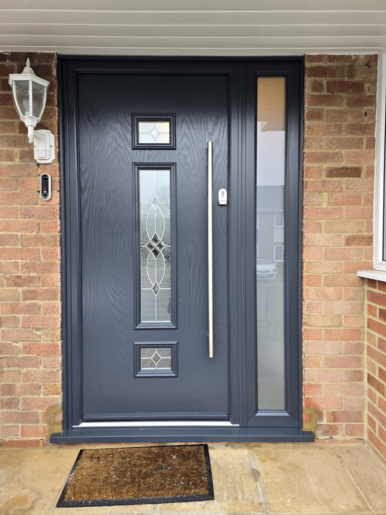 Neptune Composite door and side panel in light brick wall