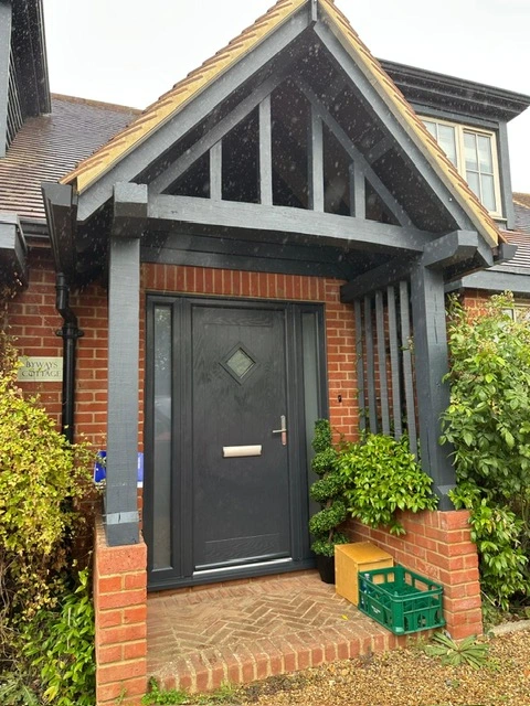 Black Pluto composite door and side panels
